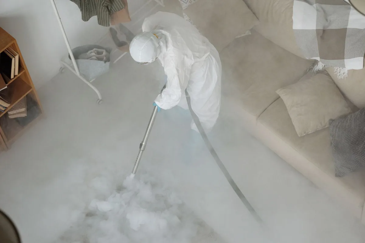 Biohazard cleanup technician in protective equipment, Melrose, MN